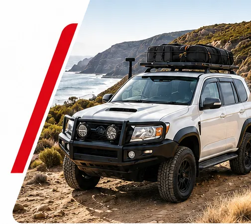 4WD fitted with roof racks and roof cargo on a coastal road